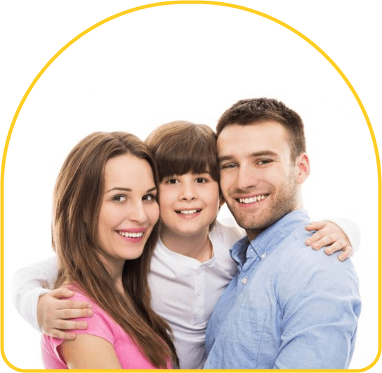 A family posing for the camera in front of a green background.